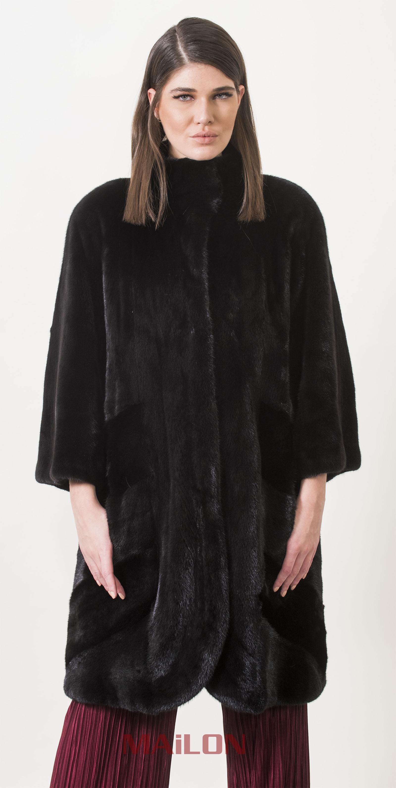 Black SAGA mink fur coat with diagonal skirt design