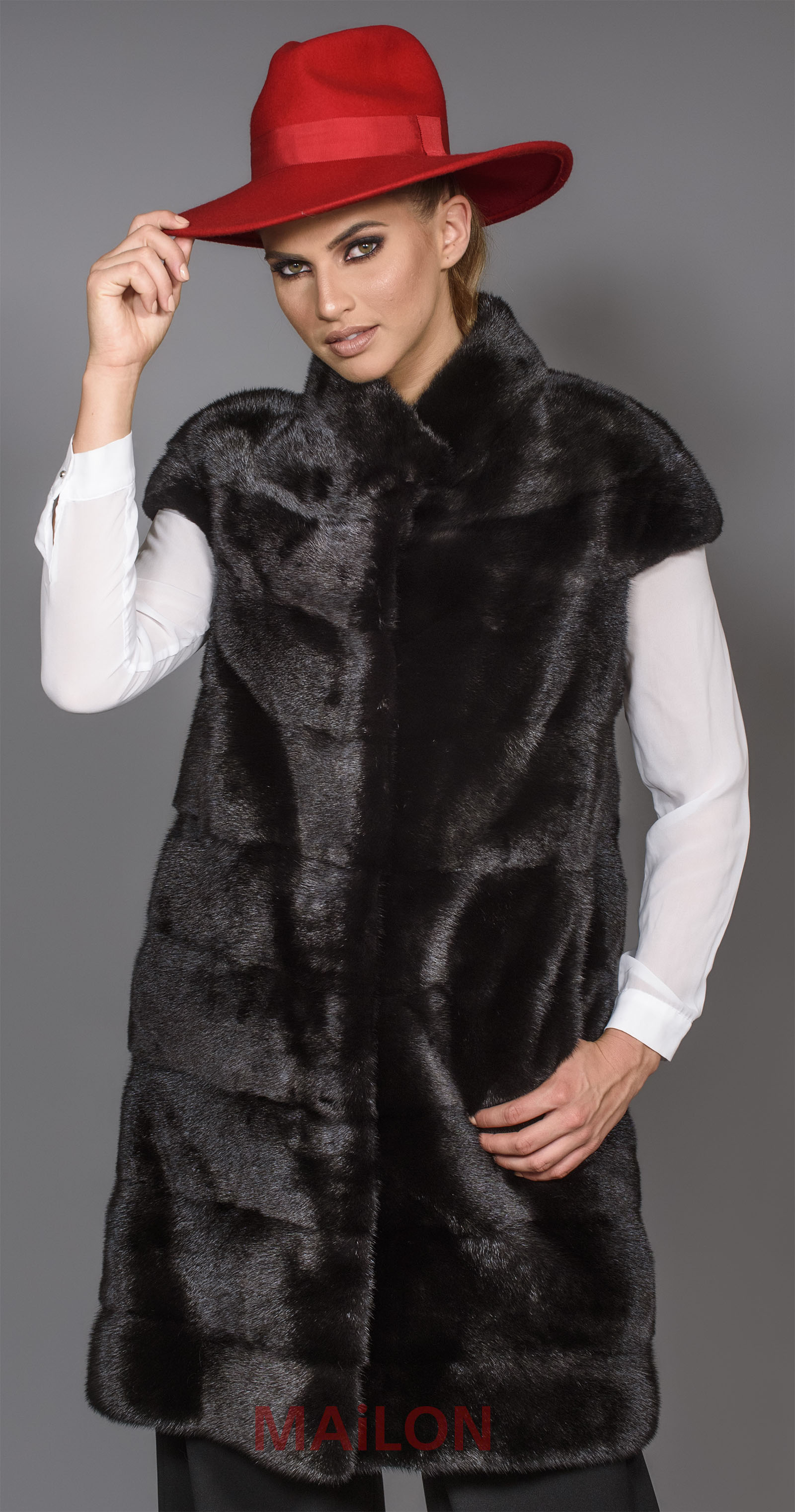 SAGA ROYAL long vest with pelts across diagonally arranged